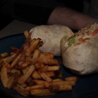 Chicken Wrap Sandwich · Chicken with cheese curds, bacon, avocado, lettuce and tomato with our house sauce. Garnishe...