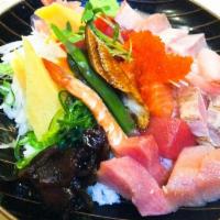 Chirashi · Assorted sashimi over sushi rice. Served with soup and salad.