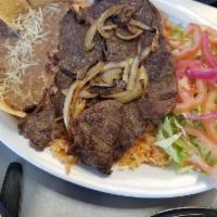 Carne Asada Plate · Comes with green salad, rice and beans and tortillas.