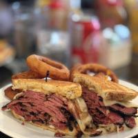 Pastrami Melt · Pastrami, Swiss cheese, grilled onions and Russian dressing served on grilled rye bread.