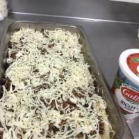 Lasagna · Layers of pasta, beef, Parmesan, mozzarella and ricotta cheeses and fresh marinara sauce, se...