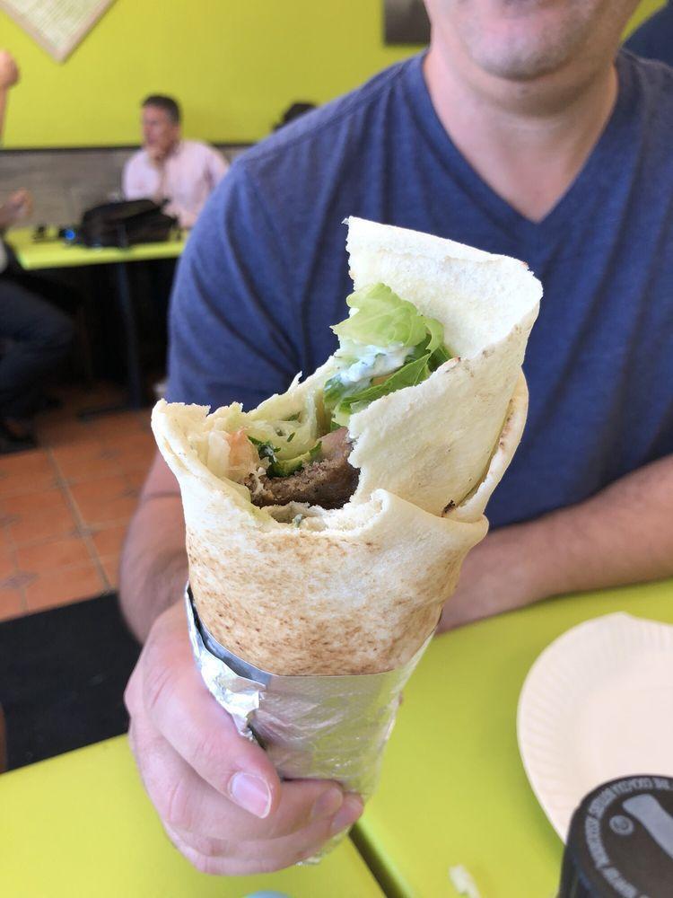 Grilled Gyro Wrap · Marinated lamb and beef served with choice of lettuce, tomatoes, onions, pickles, hummus, tahini, tzatziki, feta, tabouli, cucumbers, and banana peppers in a wrap. 