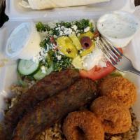 Gyro Plate Dish · Gyro served with a side of Greek salad, Jedra rice with hummus, tzatziki and pita bread. 