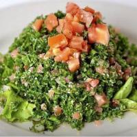 Tabouleh · Tomato, onion, wheat, parsley, mint, lemon juice and spices.