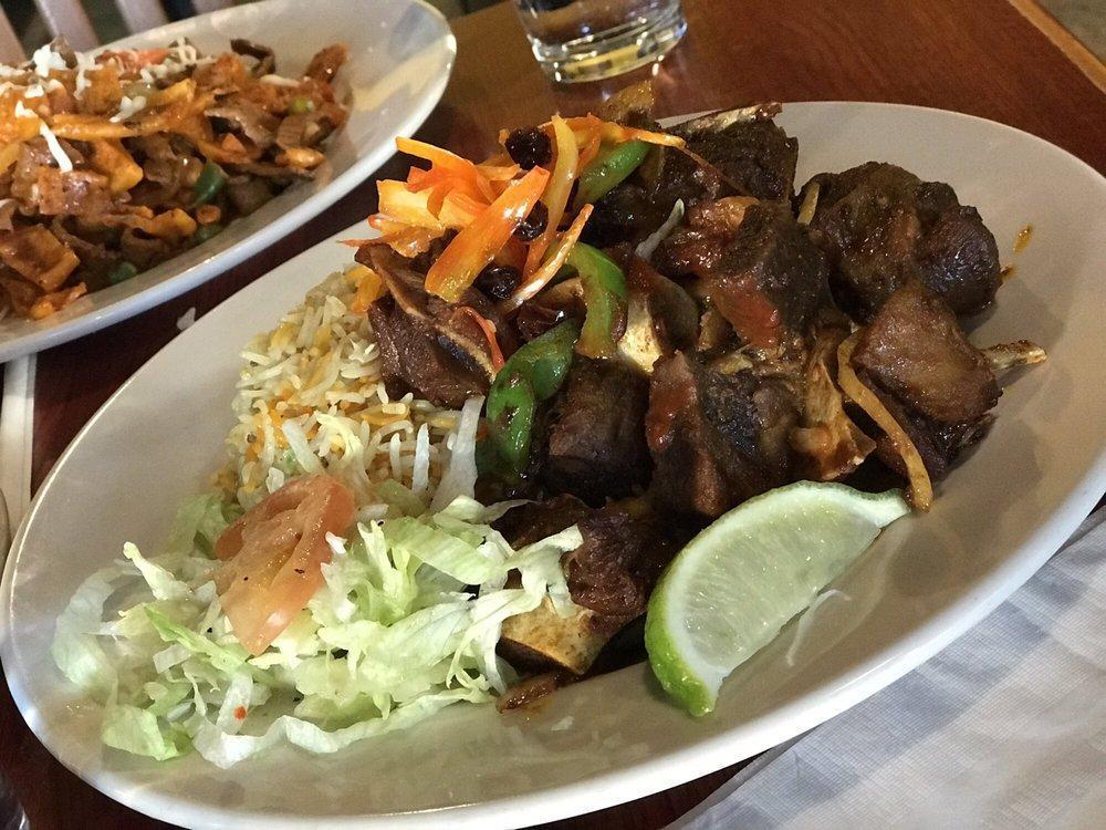 Roasted Goat Cutlet · A traditional somali dish featuring roasted goat, infused with authentic spices and herbs served in a bed of basmati rice.