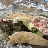 Falafel Sandwich · Served with pita, lettuce, tomatoes and choice of toppings. Served with one white sauce and ...