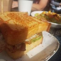 Breakfast BLT · Thick cut bacon, over-easy egg, Mighty Vine tomato, lettuce, house mayo, housemade texas toa...