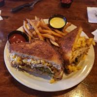 Mac Street Boys Sandwich · Jalapeno bread, spicy BBQ pulled pork, mac n' cheese, sweet pickles, and muenster cheese. Wi...