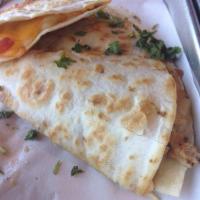 Quesadilla · A flour tortilla filled with rotisserie chicken and mixed cheeses. Served with sides of blac...
