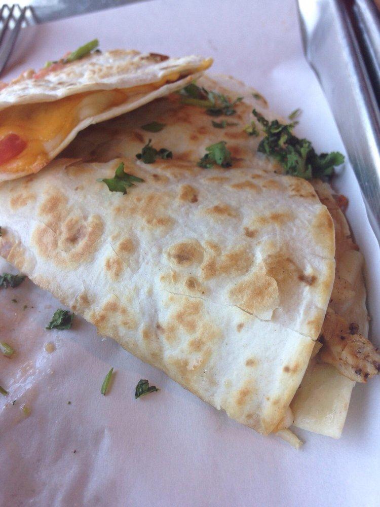 Quesadilla · A flour tortilla filled with rotisserie chicken and mixed cheeses. Served with sides of black bean salsa, chipotle sour cream, and salsa roja.