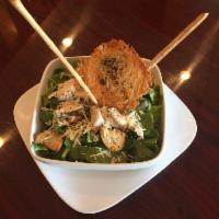 Chicken Caesar Salad · Chicken Caesar salad with homemade croutons, Parmesan cheese, and tossed in a classic dressi...