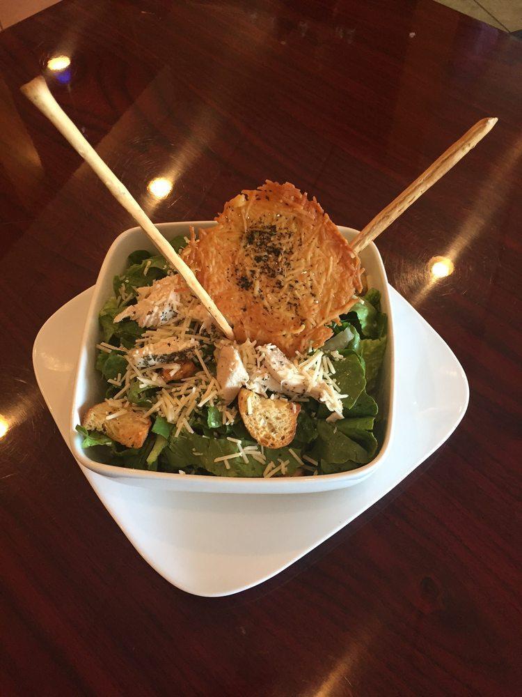 Chicken Caesar Salad · Chicken Caesar salad with homemade croutons, Parmesan cheese, and tossed in a classic dressing.