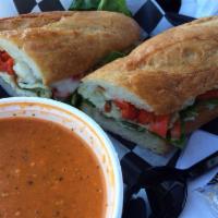 Gourmet Pork Loin Sandwich · Roasted pork loin with roasted onions, bell peppers, provolone cheese, tomato, forest greens...