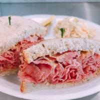 Corned Beef Sandwich · Served on the bread of choice and comes with a choice of coleslaw, potato salad, macaroni sa...