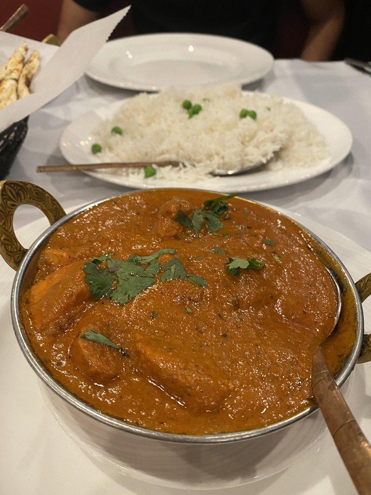 Chicken Tikka Masala · Chicken breast marinated in spices and yogurt. Grilled in the tandoori oven and cooked in a tomato based cream sauce. Served with basmati rice.