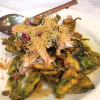 Palak Chaat · Fresh spinach dipped in a special batter, deep fried with potatoes. Served with a light yogu...