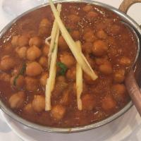 Chana Masala · Chickpeas cooked with potatoes, spices and herbs. Served with basmati rice.