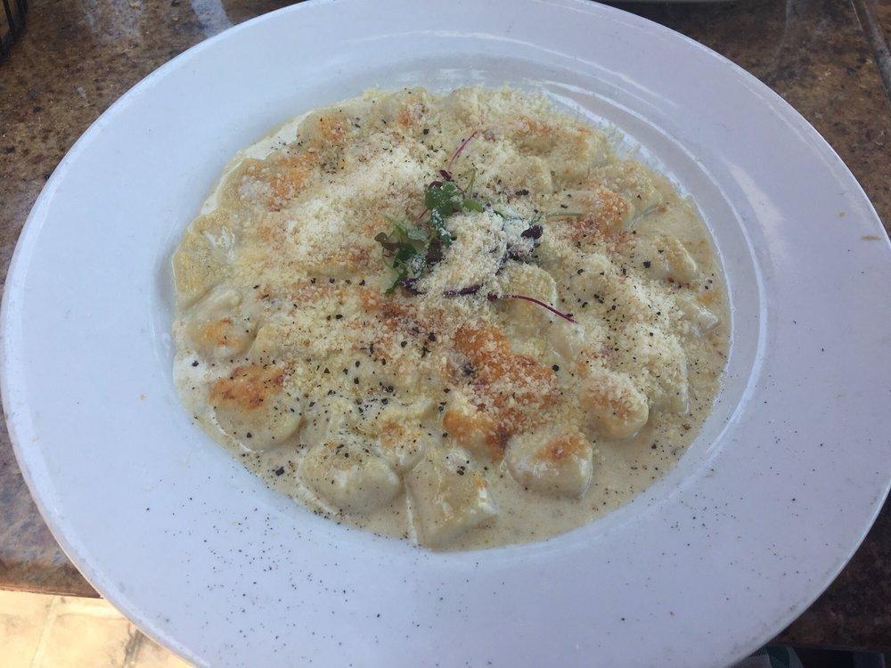 Gnocchi Gratinati · Homemade potato dumplings in a Parmesan cream sauce and au gratin.