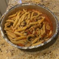 Penne Vittorio · Penne pasta with sausage, bell peppers, mushrooms in a spicy tomato sauce.