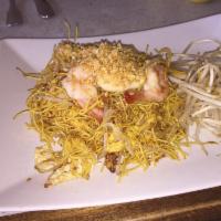 Crispy Pad Thai · Pan fried egg noodles stir fried with egg, turnips, bean sprouts, and ground peanuts.  Most ...