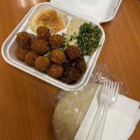 Falafel Plate · Served with crispy falafel balls (10), Mediterranean sides (5), tahina sauce, hot sauce, and...