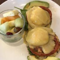 Eggs Benedict · 2 poached eggs with Canadian bacon on a toasted English muffin, topped with our hollandaise ...