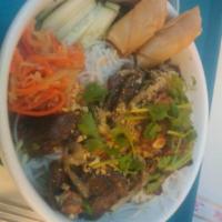 Vermicelli Delicacy · Rice noodles with fresh mint and vegetables, topped off with a spring roll and stir-fried ve...
