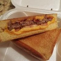 The Club Grilled Cheese Sandwich · American and Swiss cheese, honey ham, smoked turkey, bacon, and tomato on your choice of bre...