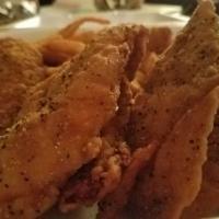 Lemon Pepper Chicken Tenders · Our breaded and deep fried chicken tenders dusted with lemon pepper spice and served with a ...