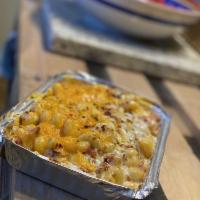 Loaded Baked Potato Mac · Cheddar and Gruyere cheese, fried potato chunks, and bacon topped with seasoned bread crumbs...