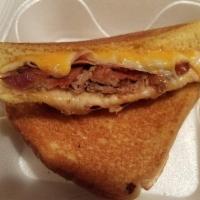 The 3 Little Pigs Sandwich · Aged sharp Cheddar and Swiss cheese, honey ham, bacon, and pulled BBQ pork grilled on your c...