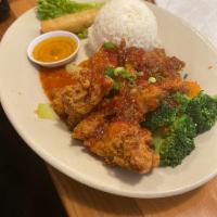 Volcano Chicken · Lightly batter fried chicken sauteed in sweet and hot chili sauce served on the bed of steam...