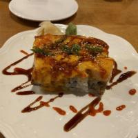 Lion King Roll · Snow crab, avocado inside, topped salmon baked with dynamite sauce, masago and green onion a...