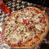 Meat Lover's Pizza · Pepperoni, salami, turkey ham, marinated chicken and sausage.