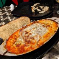 Lasagna · Layered lasagna noodles, ground bee, ricotta cheese, tomato sauce, baked mozzarella and Parm...