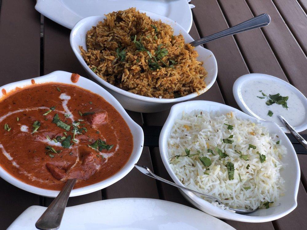 Tikka Masala · The national dish of England, slowly simmered in our famous tomato sauce with a hint of cream, zesty Indian herbs & spices. Accompanied with saffron rice. Gluten-free.