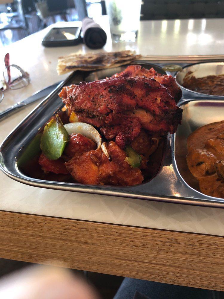 Classic Tandoori Chicken · Succulent chicken leg quarters, marinated in yogurt, ginger, garlic, with exotic spices. Cooked to perfection in the tandoor (clay oven). Gluten free.