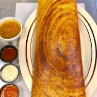 Masala Dosa · A plain lentil and rice crepe stuffed with potato masala. Served with sambar, coconut and to...