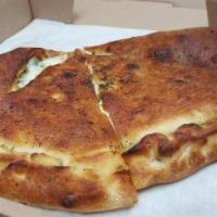 Calzone · Served with mozzarella cheese and ricotta cheese. Its served with (2x marinara cup on the si...