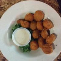 Corn Fritters · Bite-size nuggets of golden-fried sweet corn served with ranch dressing.