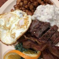 Farm Hand Breakfast Platter · Two types of meat of your choice, two eggs and a biscuit and gravy, served with country tate...