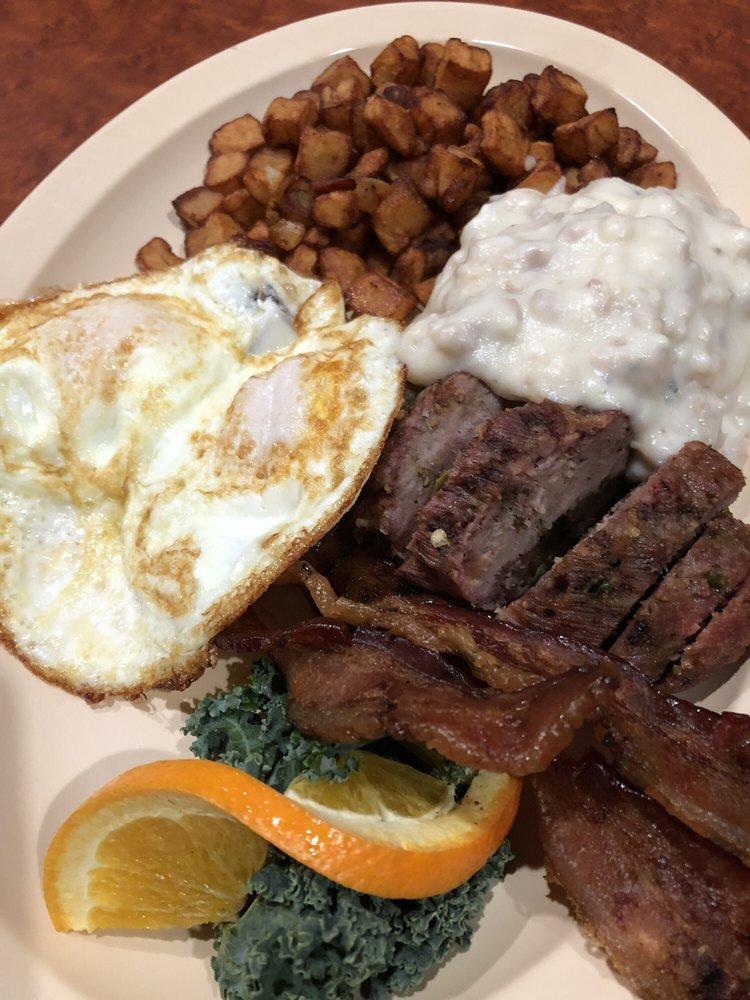 Farm Hand Breakfast Platter · Two types of meat of your choice, two eggs and a biscuit and gravy, served with country taters.