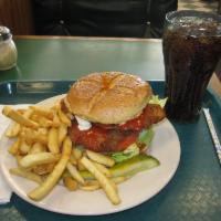 Buffalo Chicken Sandwich · Cutlets smothered in franks and blue cheese dressing, lettuce and tomato. Served with fries ...