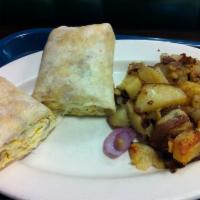 Breakfast Wrap · 3 eggs scrambled with choice of meat, onions and peppers and cheese. served with homefries