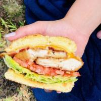 Chicken Deluxe Sandwich · Chicken cutlets, cheddar, bacon, lettuce, tomato and mayo on a grilled bulky. Served with fr...