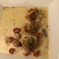 Stuffed Shrimp & Crabmeat · Served in a light buttermilk sauce with herbs and cherry tomatoes.