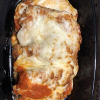 Chicken Parmigiana · Made or covered with Parmesan cheese.