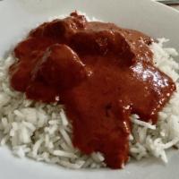 Chicken Tikka Masala · Chicken roasted in special clay pot oven, cooked in mild tomato fenugreek sauce. Served with...