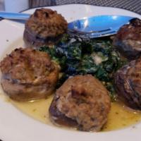 Stuffed Mushrooms · Crabmeat stuffing over spinach.