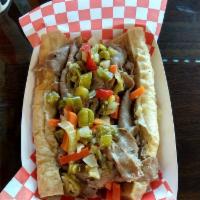 Italian Beef Sandwich · French bread filled with thinly sliced seasoned beef, dipped in its own juice and topped wit...